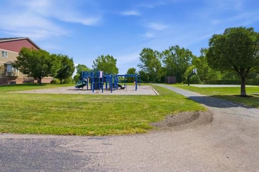 Just steps from the townhome, the neighboring green space offers a playground and basketball court, adding convenient outdoor recreation right outside your door.
