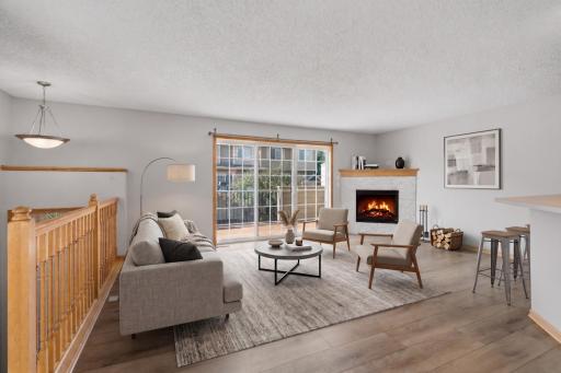 Large sliding glass doors fill the living room with natural light and provide direct access to the outdoor deck, extending the living space outside for relaxing, grilling or entertaining. -Virtually Staged