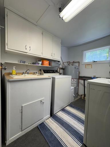 laundry room with water heater