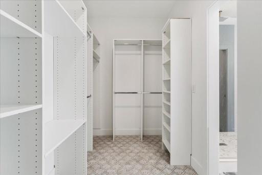 The large en-suite walk-in closet is ready, no matter how many clothes and shoes you have