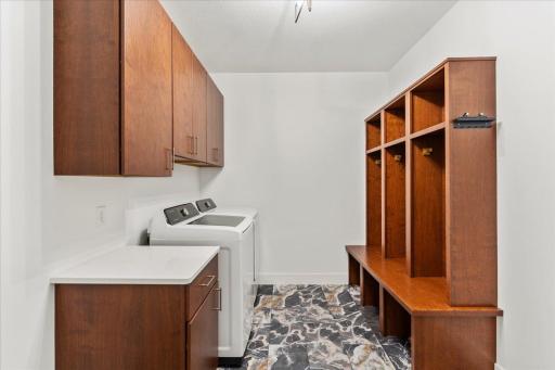 Located right off the main, attached garage, this mudroom with laundry is spacious and a great space to leave your gear without cluttering the main living spaces