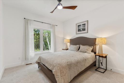 The second bedroom, located on the other end of the home in the main level offers beautiful views and a large closet