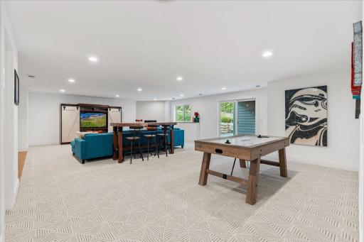 This expansive family room is so much larger than photos can do justice. A great entertaining space and can be multipurpose for gaming, movies, etc.