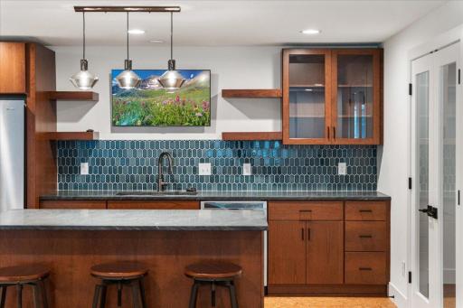 Lower-level kitchen/wet bar. This is a beautiful space to entertain, especially during a holiday gathering