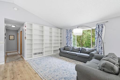 Vaulted, spacious and open main floor with loads of built in bookshelves and plenty of natural life.