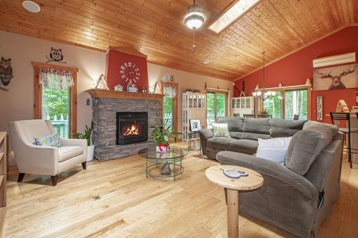Living Room is open to dining area and kitchen! Great layout for entertaining friends/family. NOTE: in floor heat throughout main floor and lower level!