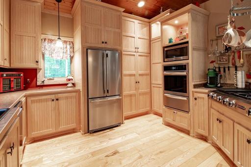 Kitchen windows face front & side, (great views!) Jenn Air gas cooktop features downdraft exhaust to outside.