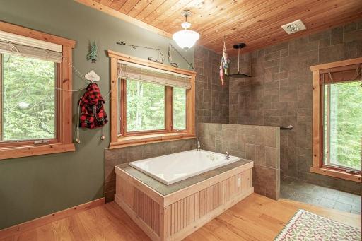 Primary bedroom includes a 13x11. Yes 13x11 private bath suite! Including a jetted tub and walk-in shower!