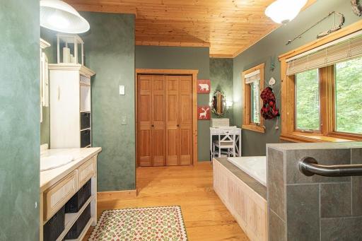 Make up vanity at far end of bath. This bedroom features 2 large closets. NOTE: grab bars installed in all 3 baths.
