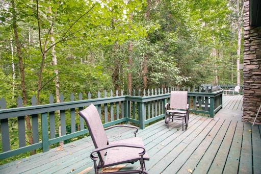 Deck off Primary bedroom seen here. Connects to deck off dining area! Awesome views.
