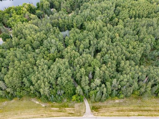 Driveway enters the property from Cty Rd 58. The home is set back way off the road. Paved road to the home!