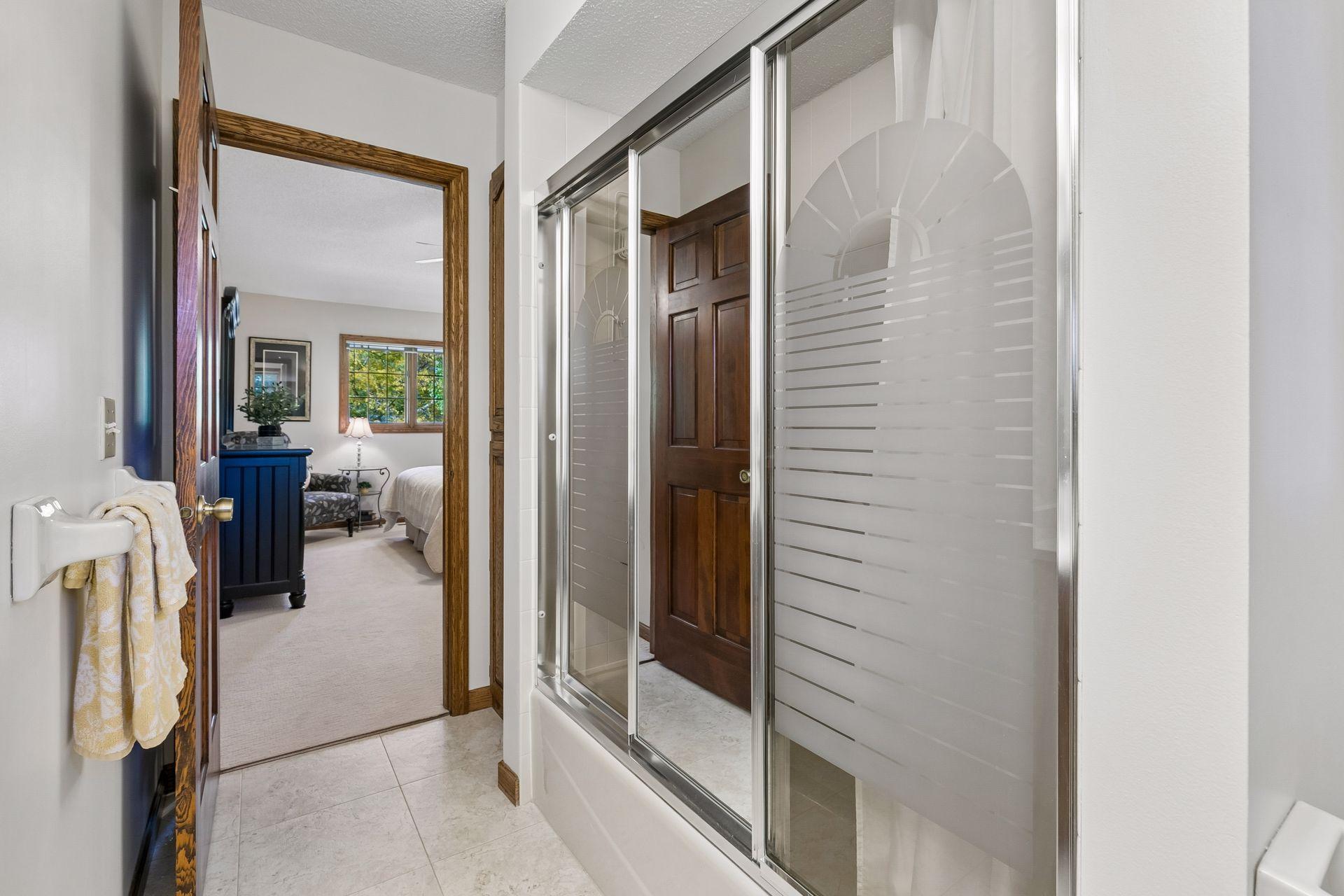Alternate view of the private, full bath in the primary suite.