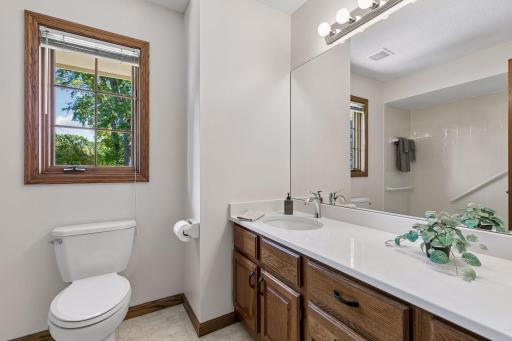 Upper level full bath with luxury vinyl tile flooring & Quartz vanity!