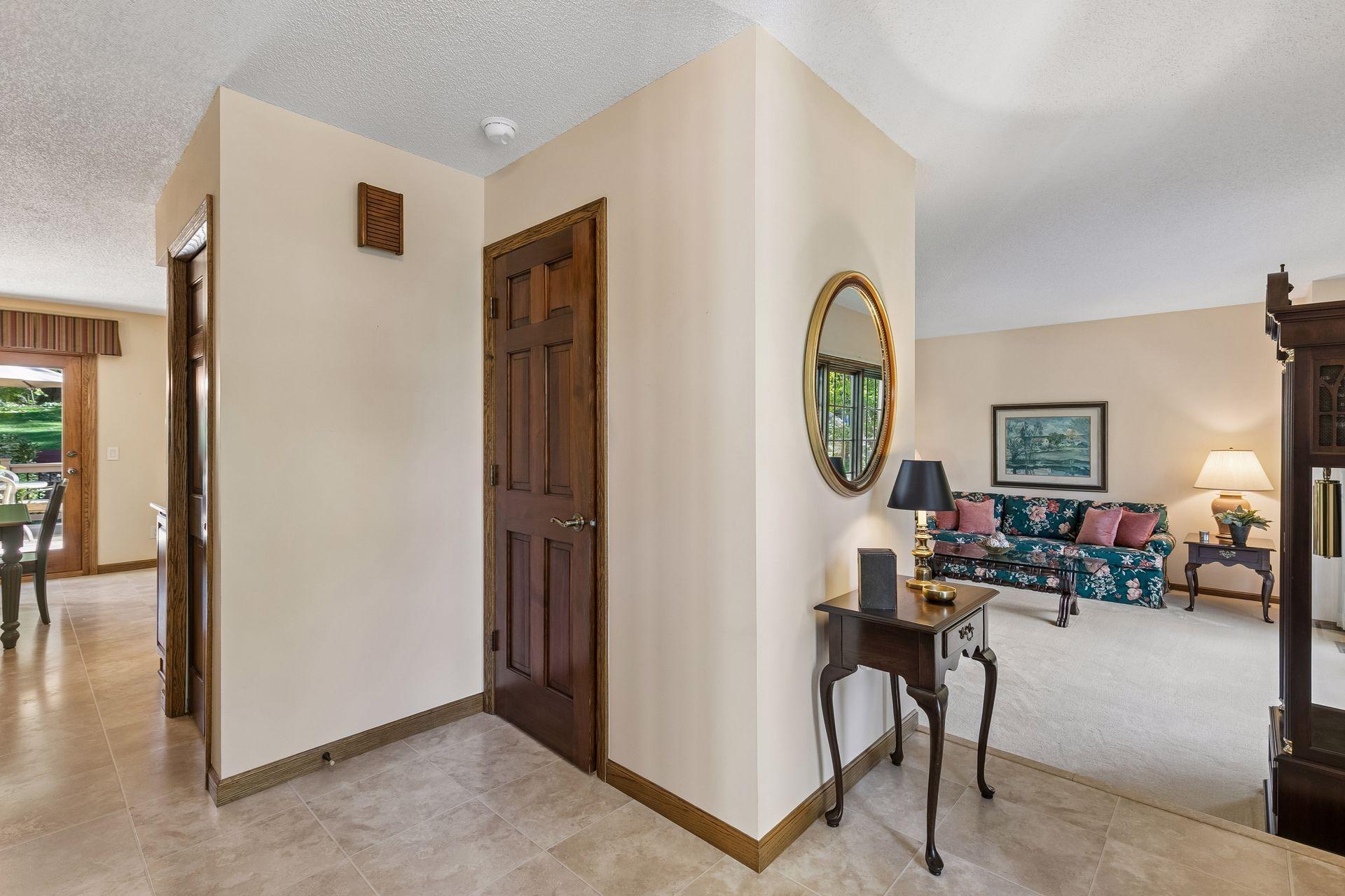 View from front entrance with nearby half bath & entry closet