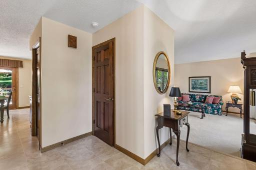 View from front entrance with nearby half bath & entry closet