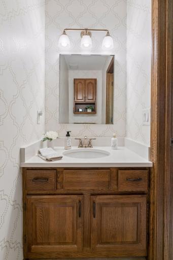 Half bath on the main level that's been updated with a beautiful Quartz counter!