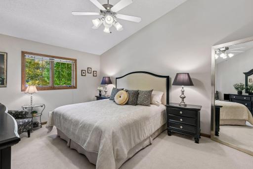 Spacious primary suite featuring brand new carpet, fresh paint, a generous walk-in closet & full bath!