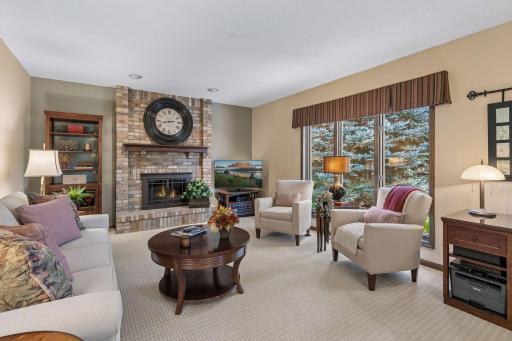 So warm & inviting....you're going to love this main level family room!