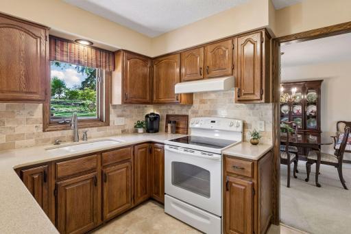 This efficient kitchen includes a timeless Travertine stone backsplash, too!
