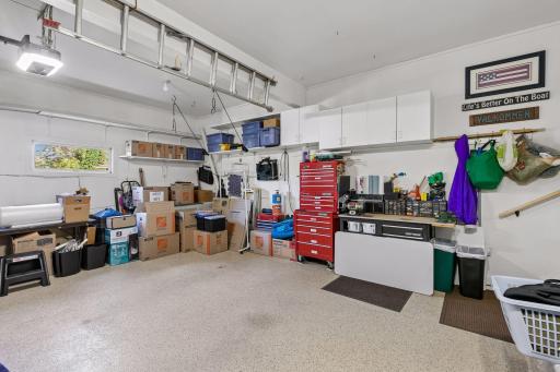 2 stall garage offering resilient polyurea coated flooring & built-in cabinets for added storage!