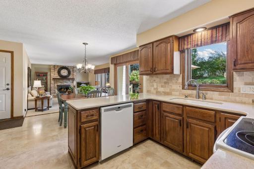 A delightful kitchen that includes Cambria Quartz counters & lovely views to the backyard!