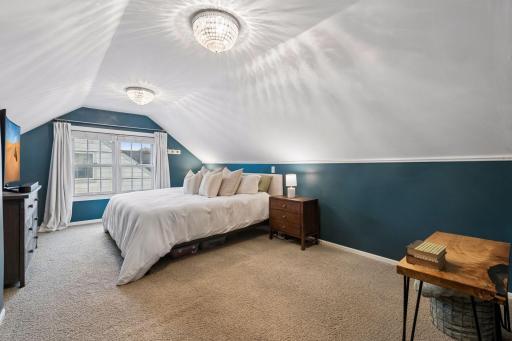 Upstairs, retreat to the private primary bedroom featuring a spacious walk-in closet.