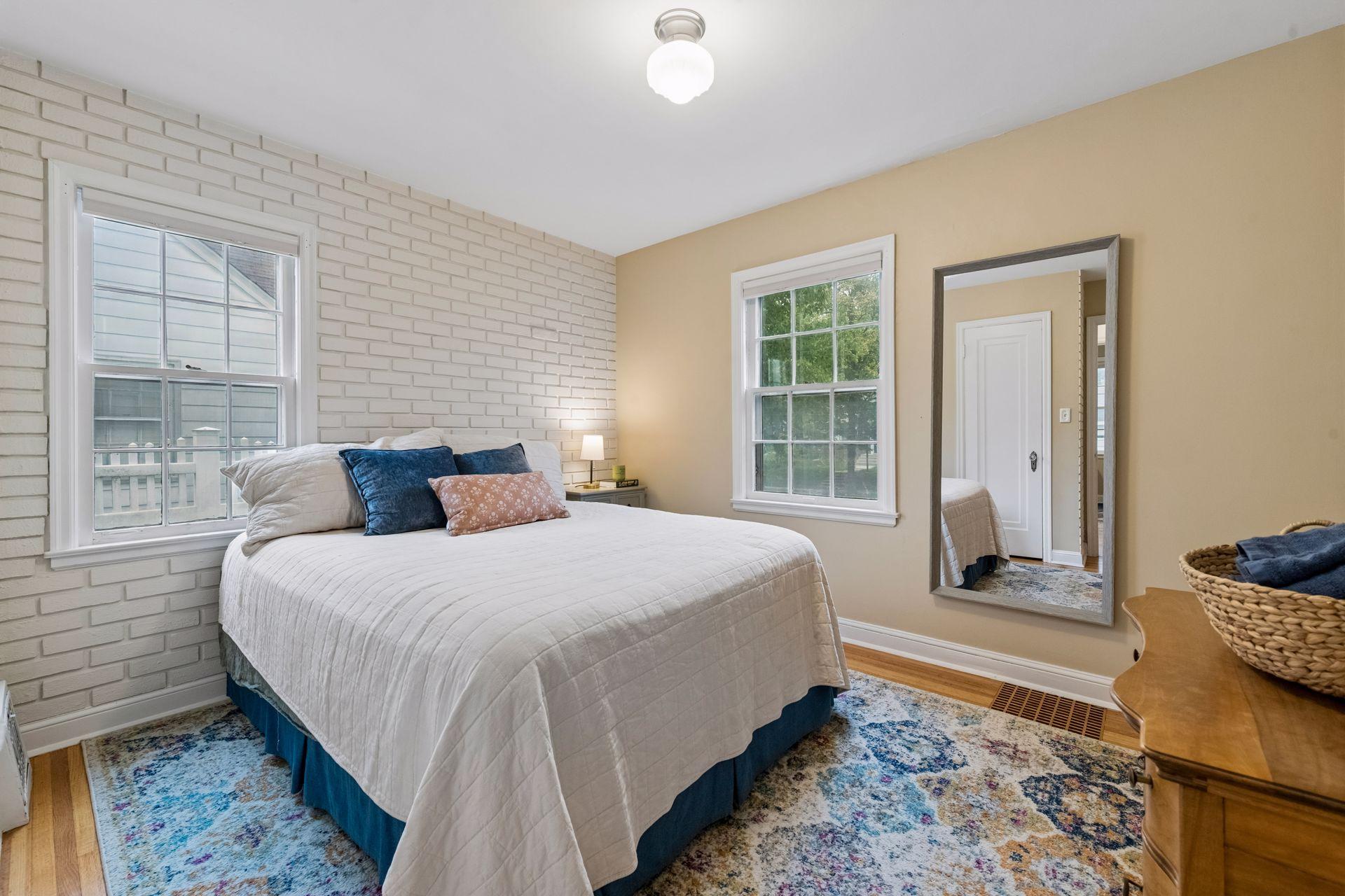 Two bedrooms and a full bathroom complete the main level.