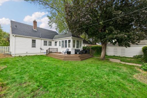Outside, enjoy a deck, patio, fenced backyard, and detached two-car garage.