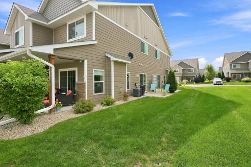 Relax and Enjoy the Outdoor Patio and Additional Green Space that Comes with this Desirable End-Unit Setting