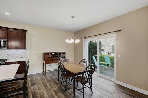 Dining Area Conveniently Located off the Kitchen, with Sliding Glass Door Providing Easy Access to the Outdoor Patio