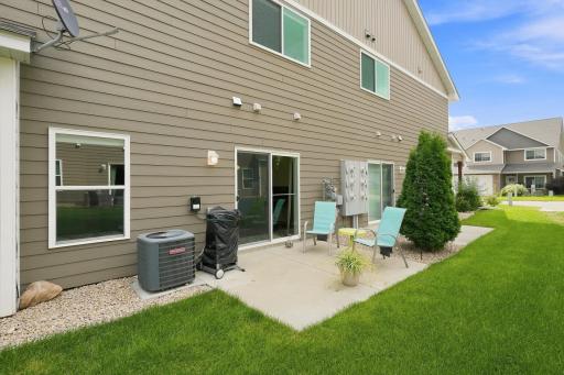 The Concrete Patio Just Off the Dining Area Provides a Great Outdoor Space for Relaxing, Grilling, or Enjoying the Surrounding Green Space