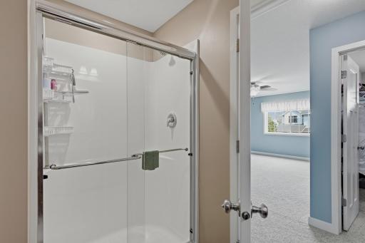 Primary Bath Includes a Separate Step-In Shower with Glass Enclosure