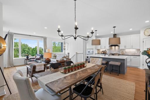 Natural light pours through as the kitchen, dining room, and living room open up to one another in a bright, airy floor plan designed for the way people actually live.