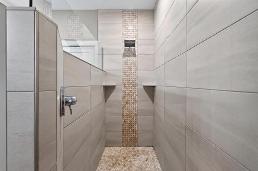 Now THIS is a shower: floor-to-ceiling tile, extra large, and absolutely impressive. This is the shower that makes you never want to leave.