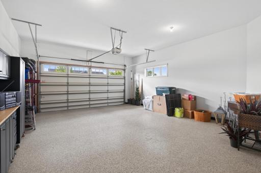 This is not your average garage with epoxy flooring and generous storage space making this two-car garage a clean, organized extension of this exceptional home.