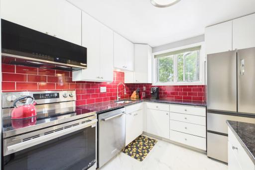 ... new custom backsplash, faucet, and hardware.