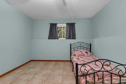 Hereâs a look at the fourth bedroom, conveniently located on the lower level.