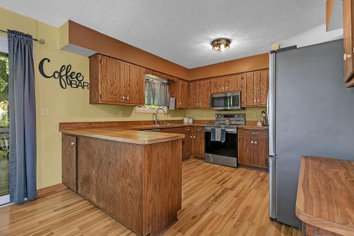 The kitchen offers ample cabinet and countertop space, providing plenty of room for storage and meal preparation.