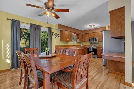 The dining room is open to the kitchen and conveniently located next to the sliding glass doors, offering easy access to the deck.