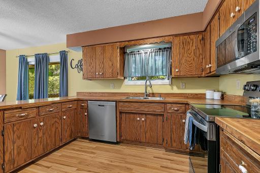 Another view of the kitchen, highlighting the sliding glass doors that provide easy access to the deck and backyard.