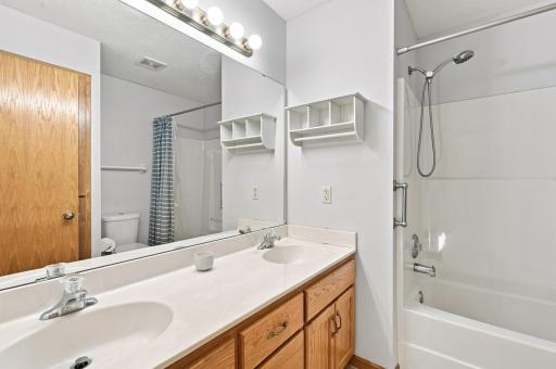 Upper level full bathroom with built in cabinets