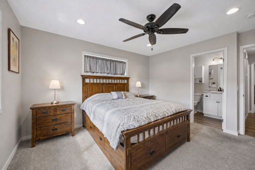 Primary bedroom w/ view of en-suite 3/4 bath