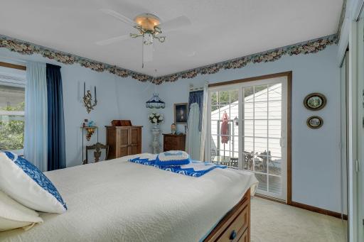 Primary Suite with 1/2 bath and walkout to private backyard patio