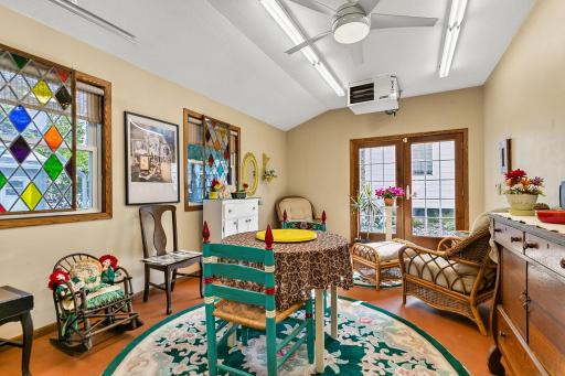 3rd stall is currently used as a studio space and features French doors that walk out to the rear patio. The garage is heated and insulated, and the 3rd stall also includes an overhead door, allowing it to easily function as a traditional garage spac