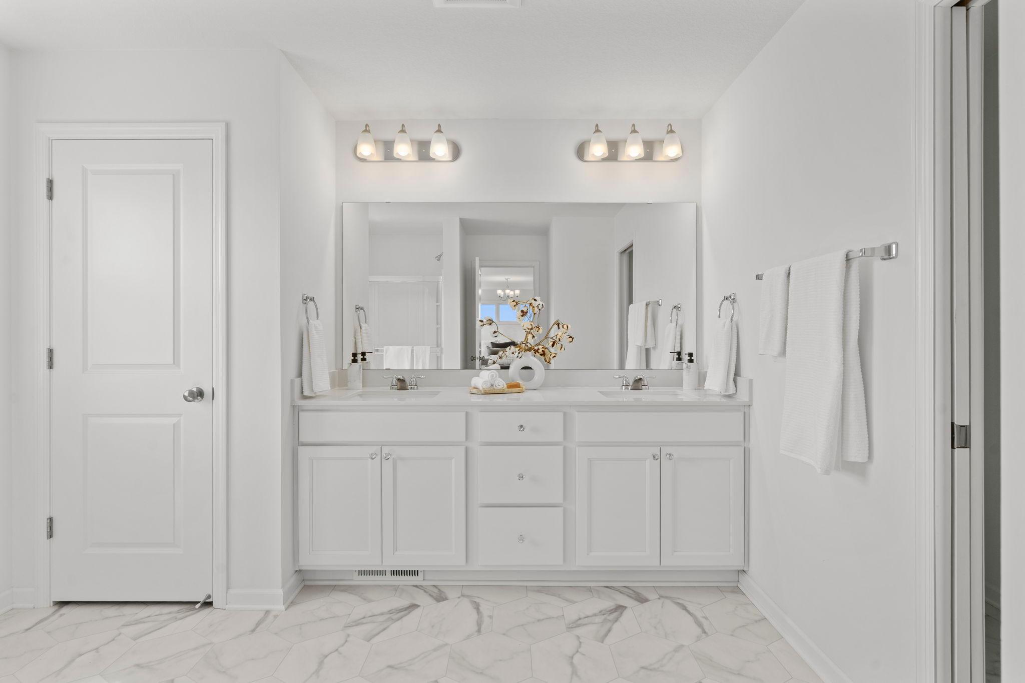 Luxurious master bathroom featuring elegant finishes, a spacious layout, and a serene spa-like atmosphere designed for everyday relaxation.