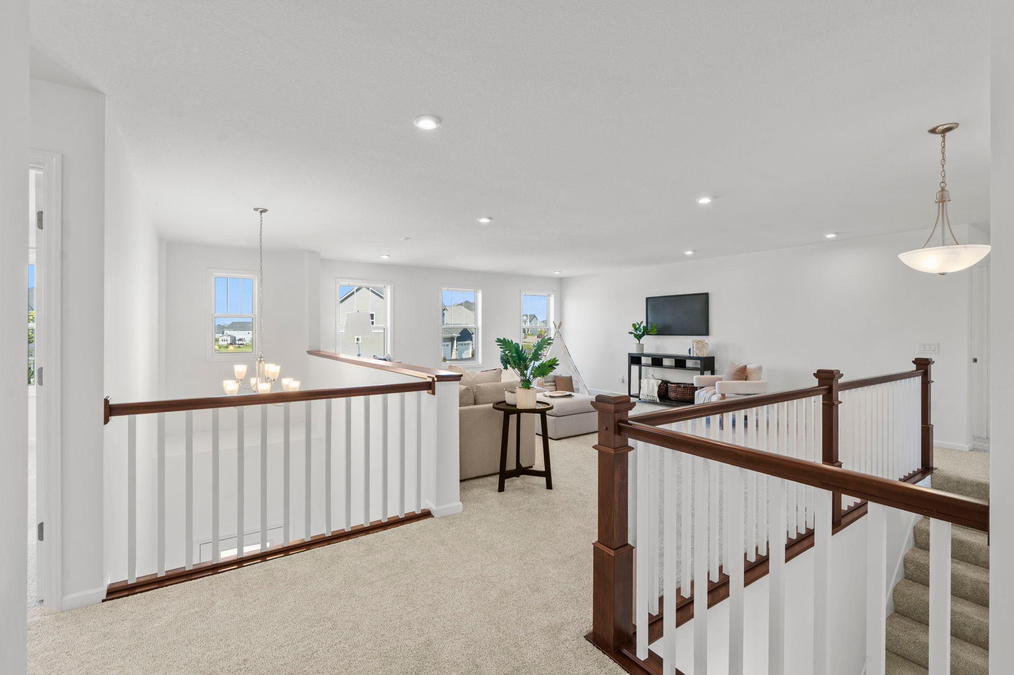 Wide, inviting hallway offering a beautiful path to the rooms, creating an open, spacious feel