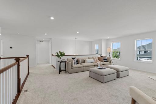 Spacious loft filled with natural light, offering a versatile open area perfect for work, play, or relaxation.