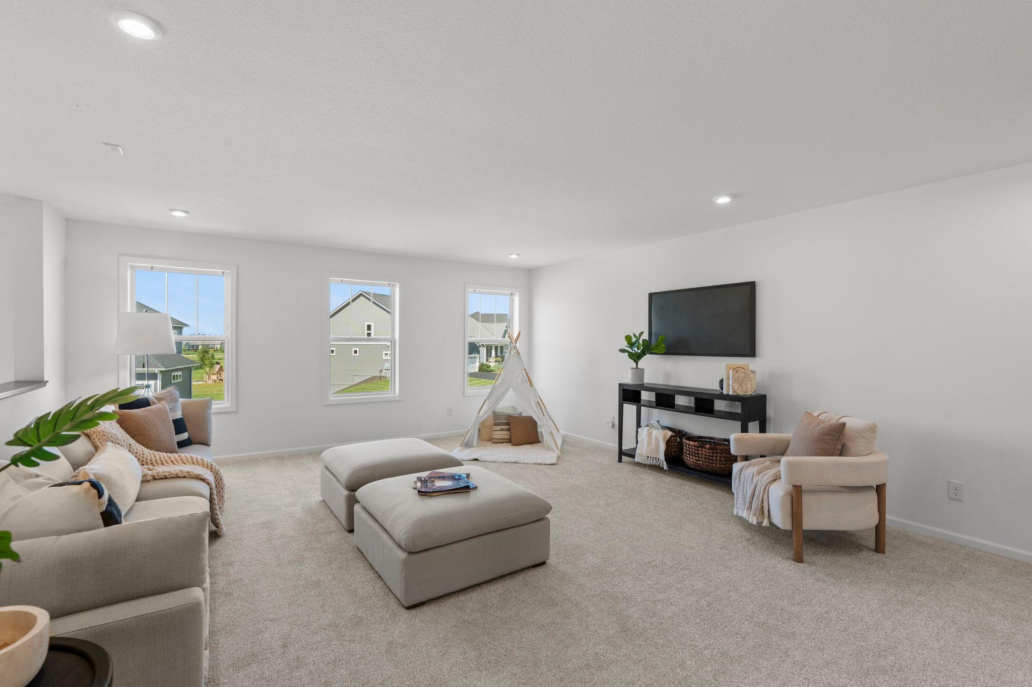 Spacious loft filled with natural light, offering a versatile open area perfect for work, play, or relaxation.