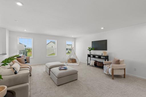 Spacious loft filled with natural light, offering a versatile open area perfect for work, play, or relaxation.