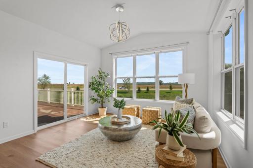 Beautiful sunroom wrapped in windows, offering bright, serene views and a perfect year-round retreat.